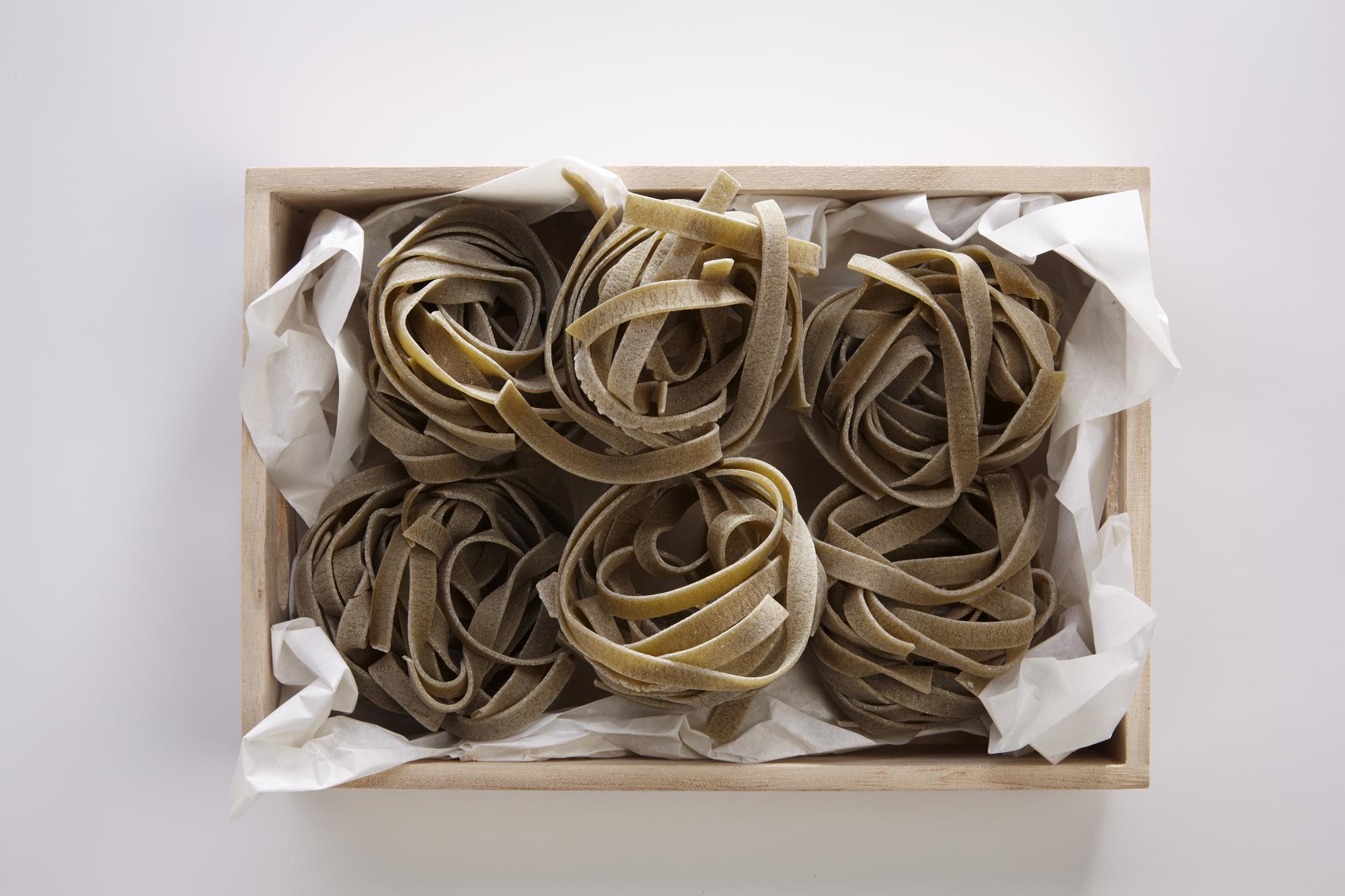 finished limited-run scarves folded in craft boxes